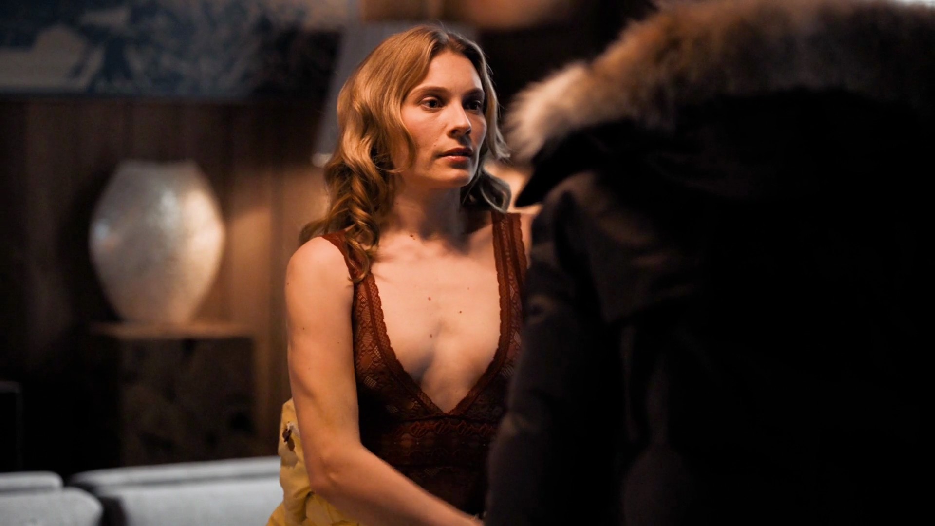 In the last scene Aliette Opheim is undressing in the bathroom as a man wat...