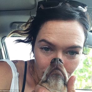 Photo of Lena Headey with a dog