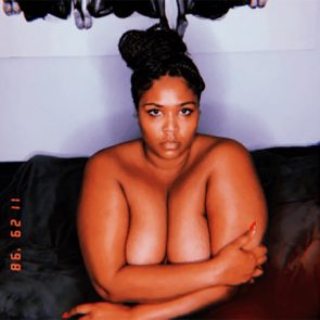 Lizzo naked covering her breasts